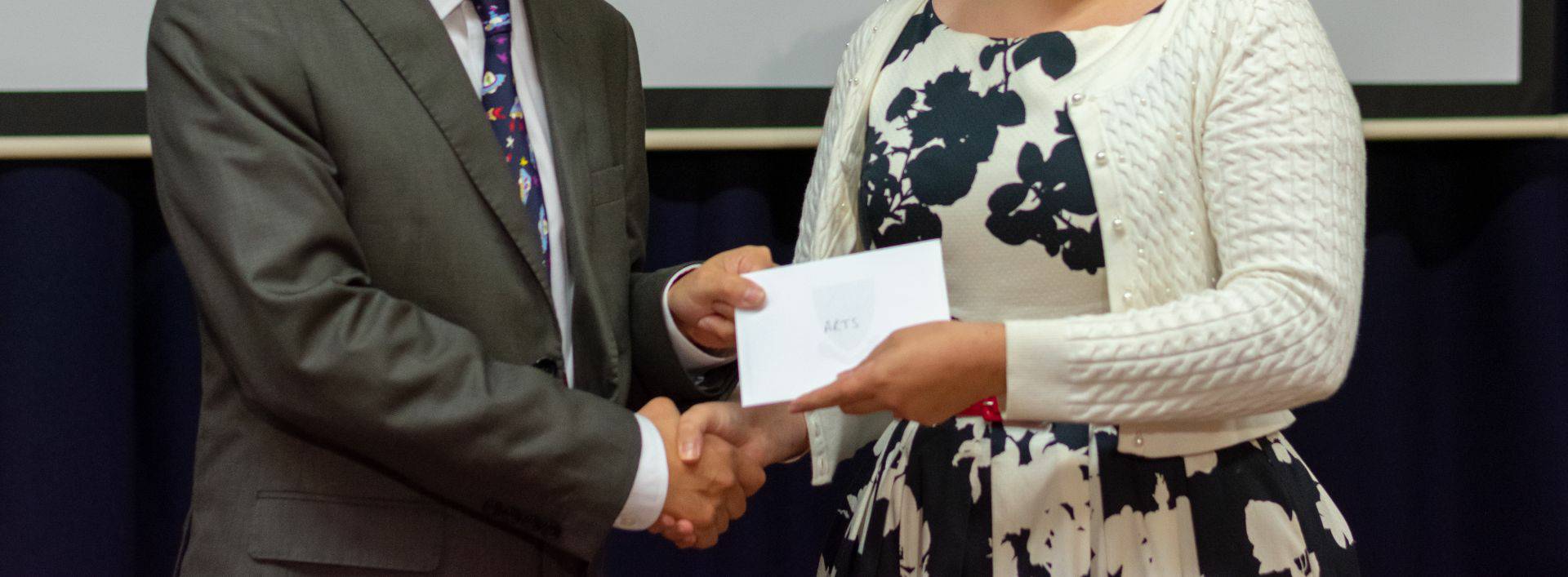 Resident receiving arts acheivement award